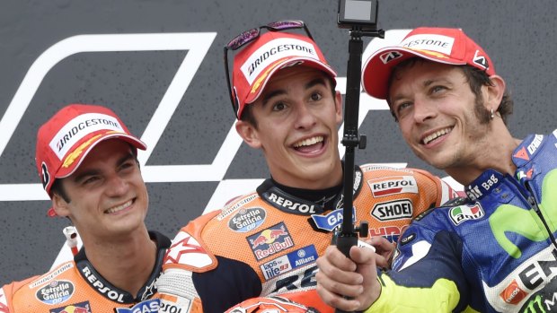 Valentino Rossi (right), who finished third in the German MotoGP, shoots a selfie with Dani Pedrosa (left), who finished second, and Marc Marquez (centre), the winner.
