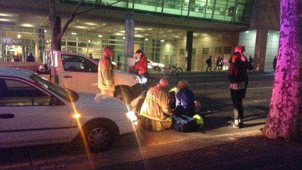 A woman is treated after being hit by a car on Harris Street in Ultimo on Monday evening.
