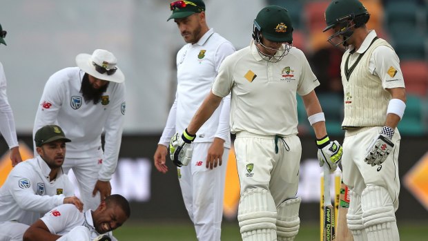 South Africa's Vernon Philander crashed to the ground after a collision with Australian skipper Steve Smith during a dramatic morning's play in Hobart.