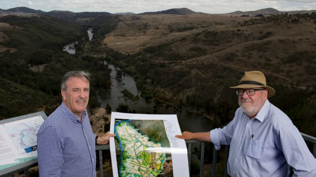 Riverview director David Maxwell and planning consultant Tony Adam at Shepherds Lookout, overlooking the Murrumbidgee River. The plateau to the right is the edge of the planned suburban development.