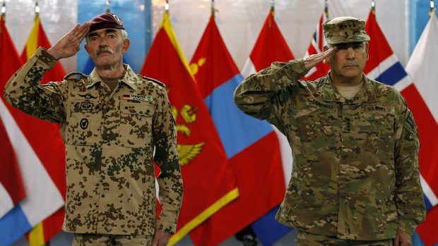Ceremonial exit: US General John Campbell (right), commander of NATO-led International Security Assistance Force (ISAF).