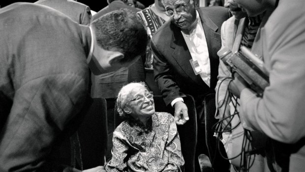 Rosa Parks greets admirers in September 1998, after a speech on race relations by US president Bill Clinton.