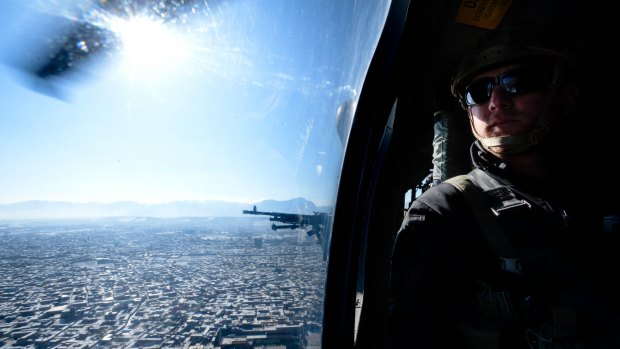 On board a Blackhawk helicopter over Kabul.