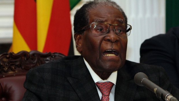 Zimbabwean President Robert Mugabe delivers his speech during a live broadcast at State House in Harare.