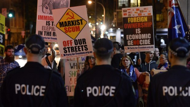 Police separate protesters and counter-protesters.