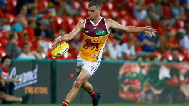 Tom Rockliff of the Lions takes a kick during the round one AFL match between the Gold Coast Suns and the Brisbane Lions at Metricon Stadium.