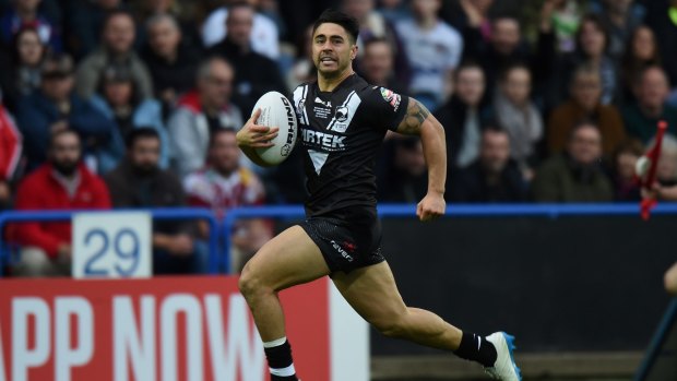 Try time: Shaun Johnson races away to score during the Kiwi's victory over England.