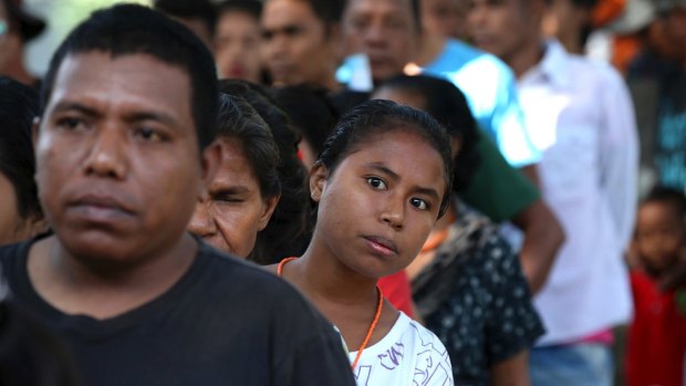 East Timorese line up to vote on Saturday, July 22.