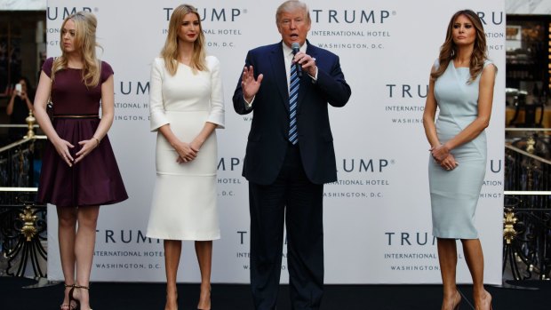 Family affair: Donald Trump with, from left, Tiffany Trump, Ivanka Trump and Melania Trump. He could establish a firewall between himself and his adult children with respect to family business affairs.