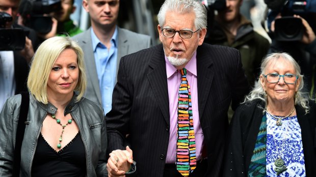 Rolf Harris arrives with his daughter Bindi  and wife Alwen Hughes at his trial in London in May.