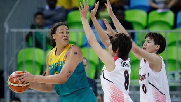 Australia centre Liz Cambage looks to pass around Japan forward Maki Takada (8) and forward Ramu Tokashiki.