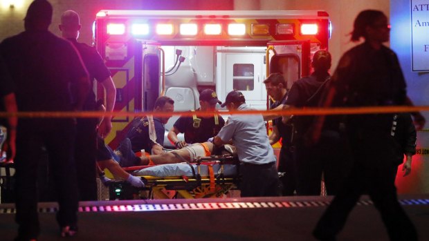 Emergency responders administer CPR to an unknown patient on a stretcher in Dallas.