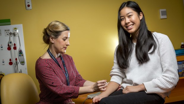 Caitlin Louey, 16, who has suffered from anaphylaxis to pecan nuts, undergoes allergy testing from research nurse Holly Shaw as a part of SchoolNuts, a Murdoch Children's Research Institute study. 