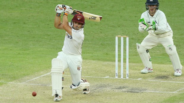 Up to the pitch:  Chris Hartley of Queensland bats during day two at The Gabba.