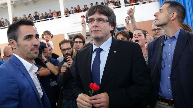 Catalan president Carles Puigdemont arrives at a sports centre in Sant Julia de Ramis, near Girona, Spain.