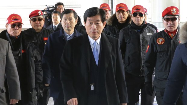 Former National Intelligence Service director Won Sei-hoon, centre, arrives at the Seoul High Court in South Korea on Monday. 