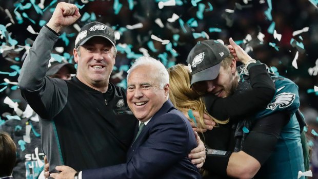 Eagles head coach Doug Pederson, left, hugs owner Jeffrey Lurie as they celebrate the team's first ever Super Bowl victory.