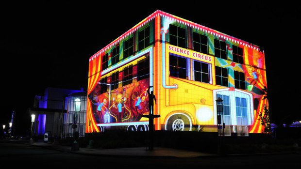 Questacon all lit up for Enlighten, which has boosted Canberra's tourism industry.