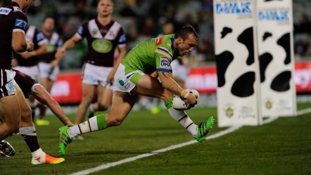 Raiders hooker Josh Hodgson scores a try against Manly in last Friday's win at Canberra Stadium. 