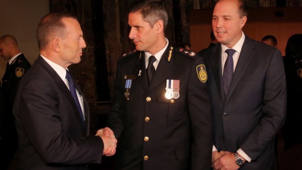 Immigration Minister Peter Dutton, with Prime Minister Tony Abbott at the swearing in ceremony of inaugural Border Force Commissioner Roman Quaedvlieg in July.