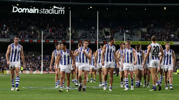 "Schoolboy stuff": North Melbourne players leave the field after their loss to Fremantle.