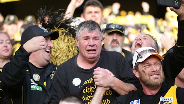 Long-suffering Tiger faithful celebrate premiership glory.