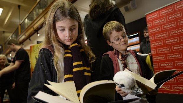 Lauren, 9, and Daniel Hurst, 7, from Mosman check out the new Harry Potter book, <em>Harry Potter and the Cursed Child</em>, at Dymocks in Sydney.