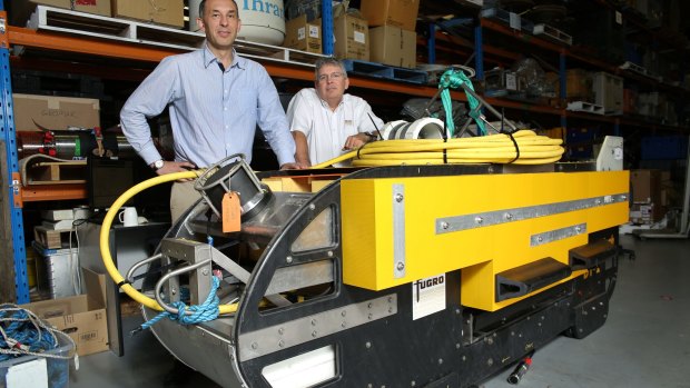 The 'fish' sonar device used in the search for MH370. Posing with the 'fish' are Fugro operations manager Paul Kennedy and Fugro managing director Steve Duffield. 