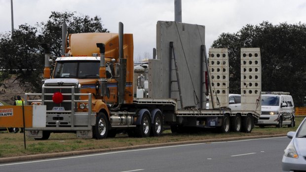  A low loader carrying pre-cast concrete appears to have brushed the underside of the Commonwealth Avenue overpass on Parkes Way heading west.