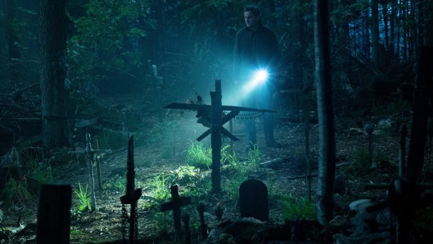 Jason Clarke as Louis investigates the burial ground in Pet Sematary. 