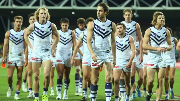 Big loss: The disappointed Dockers after round 15.