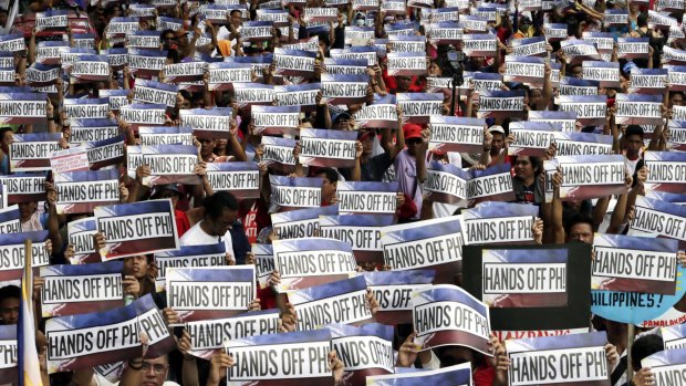 Protesters in Manila against China reclamation on Philippines Independence Day.