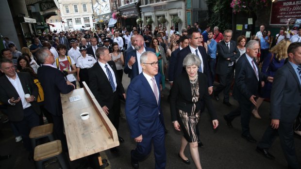 Prime Minister Malcolm Turnbull and his British counterpart Theresa May visit Borough Market in London after the attack there, which killed two Australians.