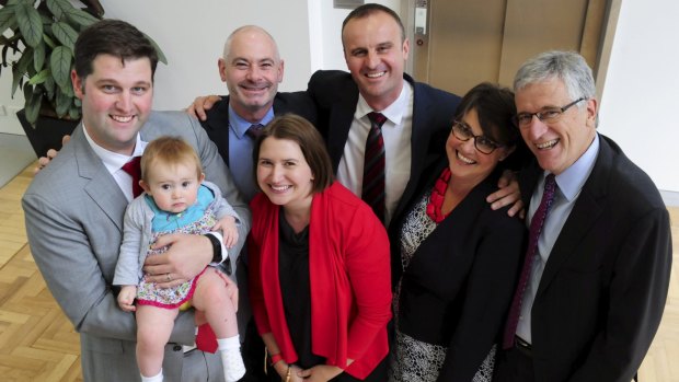 Andrew Barr is sworn in as ACT Chief Minister at the ACT Assembly. He is pictured with partner Anthony Toms, brother and sister in-law Iain and Natalie Barr with their daughter Zoe and Andrew's parents Susan and James Barr.