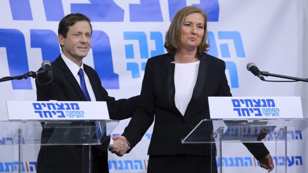 Joint force: Isaac Herzog, leader of Israel's Labour Party, and former justice minister Tzipi Livni shake hands on their collaboration.