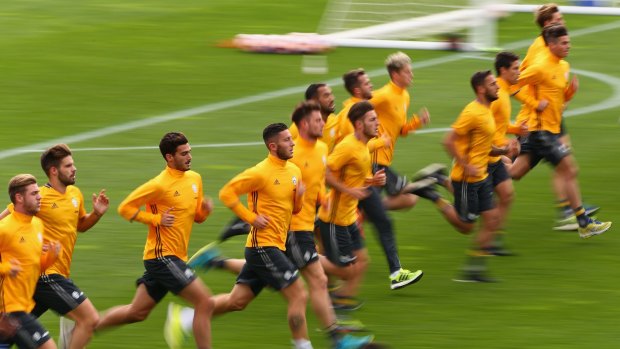 Players run laps during a warm up after the Juventus FC welcome ceremony at Lakeside Stadium.