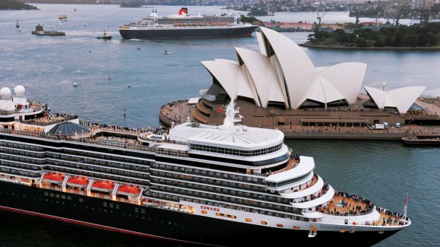 Cunard ships the Queen Mary 2 and Queen Elizabeth cross paths in Sydney Harbour in 2017. Cunard's three 'Queens' will be among 46 ships cruising Australian waters over summer. 