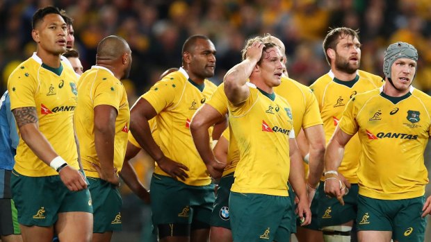 Shocker: The Wallabies during their thrashing at the hands of the All Blacks in the first Bledisloe Cup match.