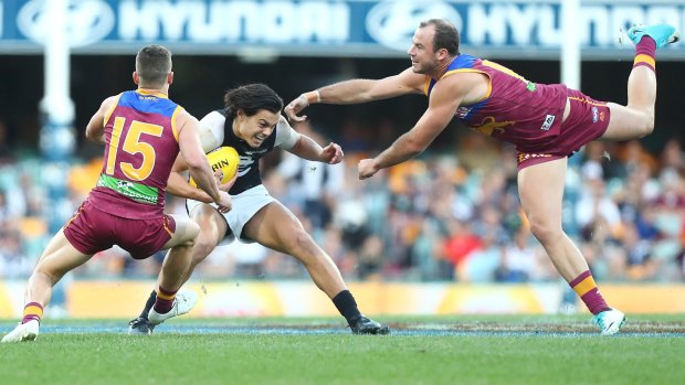Duck and weave: Carlton's Jack Silvagni  evades a tackle.