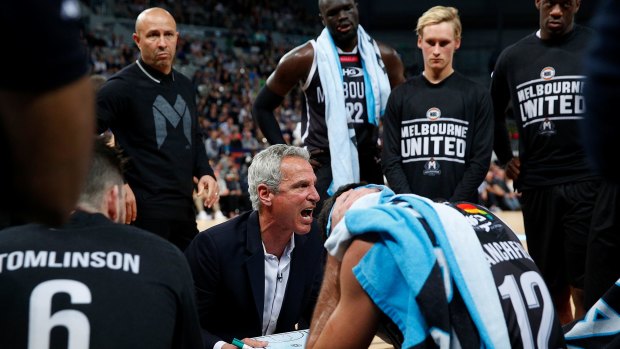 Heated: Melbourne United coach Dean Demopoulos addresses his team.
