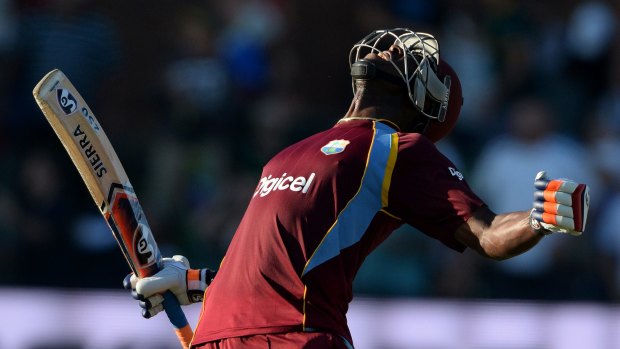 West Indies batsman Andre Russell celebrates beating South Africa at Port Elizabeth.