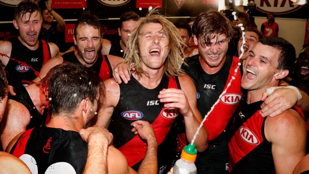 Feeling it: Dyson Heppell lead the celebrations after round one victory over the Hawks.