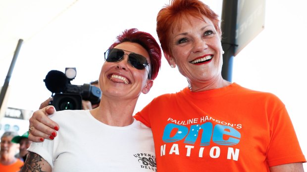 One Nation leader Senator Pauline Hanson with a voter on the Queensland campaign trail. 