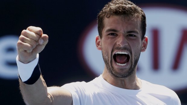 Grigor Dimitrov of Bulgaria celebrates after defeating Marcos Baghdatis of Cyprus in their men's singles third round match.