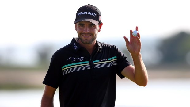 Troy Merritt waves to the gallery.