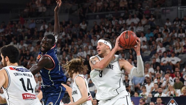 United in defence: Josh Boone takes control for Melbourne.