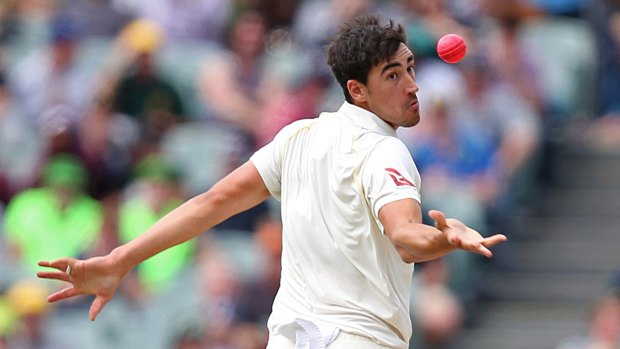 Anything you can do...: Australia's Mitchell Starc in the midst of juggling the catch that removed Jonny Bairstow.