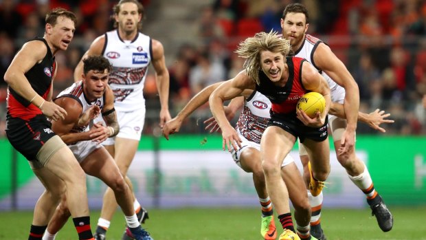 Essendon's Dyson Heppell makes a break for it.