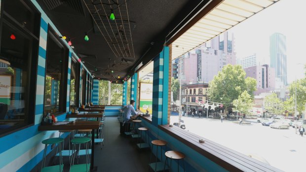 Lolling: Customers can watch the world go by from the comfort of the restaurant balcony.
