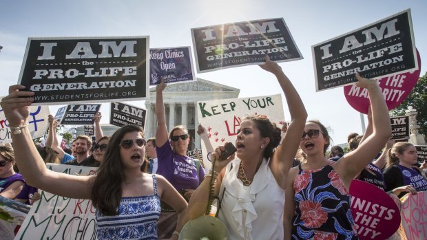 Anti-abortion activists demonstrate in front of the Supreme Court in Washington.